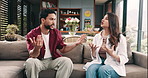 Couple, fight and stress on sofa, home and frustrated for affair, crisis and talk in living room. Man, woman and angry with conflict, questions and divorce for cheating with discussion at apartment