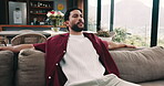 Thinking, relax and man stretching on couch for reflection, free time and happy memories on weekend break. Contemplation, remember and person resting with peace in apartment, chilling and comfortable