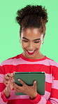 Smile, woman and student with tablet in studio for research, education results and scholarship. Happy, person and digital for online learning, study schedule and university portal on green background