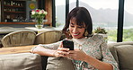 Smile, woman and phone on couch at house for social media, surfing internet and reading ebook. Mature person, relax and mobile app for online chat, browsing website and message notification in lounge