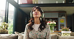 Headphones, relax and mature woman in home listening to audio, calm music and breathe on weekend. Apartment, living room and person with streaming subscription for podcast, playlist and meditation