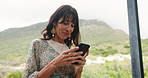 Woman, phone and smile on balcony for social media with holiday, vacation and morning message Reading, hospitality and person outdoor for relax, calm and online review with travel and accommodation