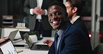 Man, face and happy at office meeting for financial review, team and night with laptop in boardroom. Person, broker and group with computer, portrait and smile in dark workplace at investment agency