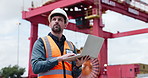 Man, logistics and laptop at port, typing and thinking for supply chain management, export or review. Person, computer and report with distribution schedule, shipping or container transport in Spain