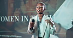 Speaker, microphone and conference with business black woman for discussion, gender equality and tech workshop. Presenter, feminism seminar and inclusion expo with person in convention for summit