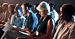 Conference, audience and business woman with tablet for investment summit, notes and think. Crowd, seminar and mature person with tech for financial convention, listening or insight in auditorium