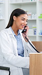 Pharmacist, woman and talking with phone call in pharmacy for online order, telehealth or prescription. Drug store, professional or chat to client for healthcare support, medication follow up or help
