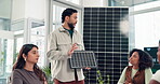 Presentation, solar panel and meeting with business man in office for photovoltaic pitch, team or planning. Renewable energy, grid prototype and sustainability project with employees in eco startup