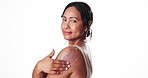 Face, shoulder and sunscreen with woman in studio to apply cream for spf or uv protection. Moisturizer, skin health and smile of mature model isolated on white background for satisfaction or wellness