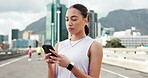 Fitness, cellphone and woman in city, internet and digital app to track progress. Outdoor, athlete and healthy person with smartphone, training and message to contact, social media and communication