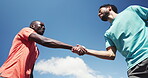 Fitness, team and handshake with people outdoor for training, support and caching advice. Running club, fist bump and workout partners with low angle of runners shaking hands for connection and goal