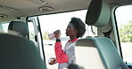 Fitness, woman and drink water for health, smart watch stats or nutrition by car on break. Happy, runner or black person with hydration in city by vehicle, wellness or check exercise progress outdoor