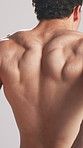 Athlete, man and flex back in studio for fitness, muscle growth and check progress with power. Shirtless, male person and body strength from exercise, bodybuilder transformation and white background