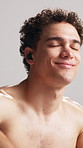 Earphones, happy man or topless in studio for fitness, sports radio or playlist for motivation. Streaming music, white background or athlete with audio tech for workout, hip hop track or nod to sound