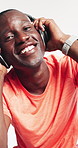 Man, face and dance with headphones in studio with fitness, smile and excited on white background. Person, happy and portrait with energy, streaming subscription and listen to music in Nigeria
