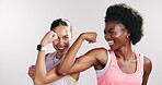 Flexing, women and fitness in studio, face and excited for muscle development, laughing and bonding. Happy, friends and  people with biceps, wink and peace sign for health goals or white background
