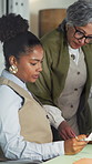 Women, paperwork and discussion in office for planning, feedback or project management. Mature manager, intern or document with mentor for job requirements, daily tasks or agenda for small business