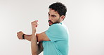 Man, stretching arms and exercise in studio for fitness routine with mockup space on white background. Person, warm up and breathing with muscle, training and start workout with thinking for wellness