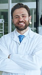 Science, crossed arms and face of man in lab for medical research, vaccine development or career. Pharmaceutical, healthcare and portrait of person with confidence, pride and smile for medicine study
