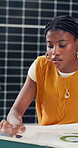 Creative, black woman and document with laptop in office for results, energy saving stats and sustainable. Person, typing and pc with photovoltaic grid info, company performance and solar panel sales