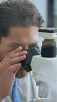 Scientist, man and analysis in lab with microscope for sample inspection, biotech and stem cell research. Bokeh, person and equipment with science, medical innovation and cure development for cancer.