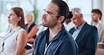 Conference, crowd and listening with business man in convention center for development workshop. Attention, audience and education with employee group in auditorium for professional tradeshow