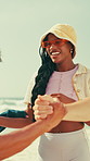 Friends, people and handshake at beach, excited and reunion with discussion, happy and summer holiday. Group, gen z woman and shaking hands for greeting, hello or smile with talk by ocean on vacation