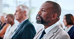 Audience, conference and listening with business man in convention center for development workshop. Attention, crowd and education with employee group in auditorium for professional tradeshow