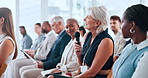 Audience, woman or talk with mic in business conference for startup advice, feedback or plan. Mature person, opinion or crowd at trade show for knowledge, company development or professional insight.