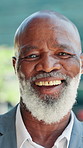 Mature businessman, face and smile in city, pride or confident with career in real estate investing. African person, realtor and advisor in portrait, happy or property development job in Nigeria