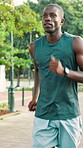 Runner, fitness and man with running at park for pace training, endurance challenge or cardio. Breathing, black person and jog in nature for marathon practice, sports performance and wellness workout