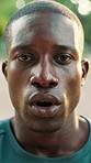 Face, exercise and tired black man breathing for workout recovery, cardio break and health. Person, fatigue and runner outdoor for rest, wellness and determination for fitness challenge with portrait