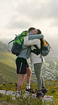 Hiking, hug and high five with couple outdoor for bonding, success and trekking achievement. Adventure, backpacking goals and love with man and woman in nature for celebration, trust and support