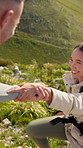 Hiking, help and couple with fitness, mountain and bonding together with environment. Outdoor, hiker or man with woman, support or travel with journey, countryside and trekking with adventure or love