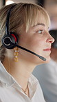 Woman, headset and night at call center in office, reading or typing with smile for lead generation. People, consultant and agent with mic, thinking and insight for sales in dark workplace at company