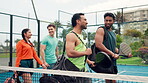 Conversation, padel and walking with friends on court together for fitness or training session. Exercise, sports and talking with group of people outdoor for practice, team building or workout