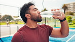 Man, fitness and drinking water with bottle in padel court for hydration, recovery or rest. Active, male person or sport player with mineral liquid or beverage for natural sustainability or break