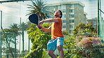 Athlete, man and jump with racket for padel fitness, match practice and sports competition. Male person, serving ball and game for tennis challenge, agile movement and technique skills for tournament
