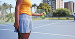 Tennis, training and hands of woman with ball on court for practice, exercise or workout for challenge. Personal trainer, sports and people with racket, equipment or serve for game, match and fitness