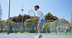 Sports, tennis and man on court outdoor for match, training or cardio workout with competition. Fitness, racket and athlete hitting ball for game, practice or exercise with equipment for challenge.