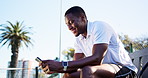 Tennis, sports and black man with phone for rest, break and online for workout app, social media and internet. Fitness, happy and person on smartphone for training, exercise post or practice for game