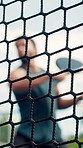 Padel tennis, net and man with exercise for training, competition and playing with energy for sport. Low angle, player and person with equipment for game, court workout and challenge for fitness