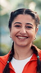 Face, outdoor and happy woman with fitness, funny and competitive with confidence. Professional athlete, person and player with pride, sports career and exercise with humor and laughing in India