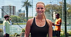 Face, padel court and woman with smile, fitness and sports game with challenge. People, tennis player and happy athlete with confidence, competition and pride with health, training and practice