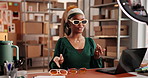 Woman, unboxing and ring light with sunglasses, talk and happy with choice for online audience. African girl, dropshipping and influencer with affiliate marketing, fashion or social media at store