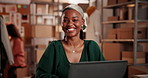 Face, laptop and smile of designer black woman in office at night for small business planning or research. Computer, creative and design with happy African person in dark workplace for startup