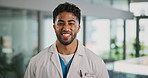 Face, doctor and happy man in clinic as healthcare consultant, wellness and laugh. Portrait, confident employee and medical professional with pride, funny person or about us in hospital in UAE