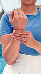Sports, tennis and hands of woman with wrist pain for workout injury, accident and sprain. Padel, fitness and person with tension, joint ache and carpal tunnel for exercise, training and practice