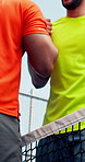 People, shaking hands, padel and tennis court, game and respect for competition, low angle and match. Athlete, handshake and together at net, success and motivation for training at fitness club