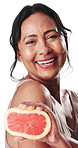 Skincare, grapefruit and face of woman in studio for wellness, hydration or natural benefits. White background, beauty and portrait of happy person with fruit for anti aging, cosmetics or dermatology